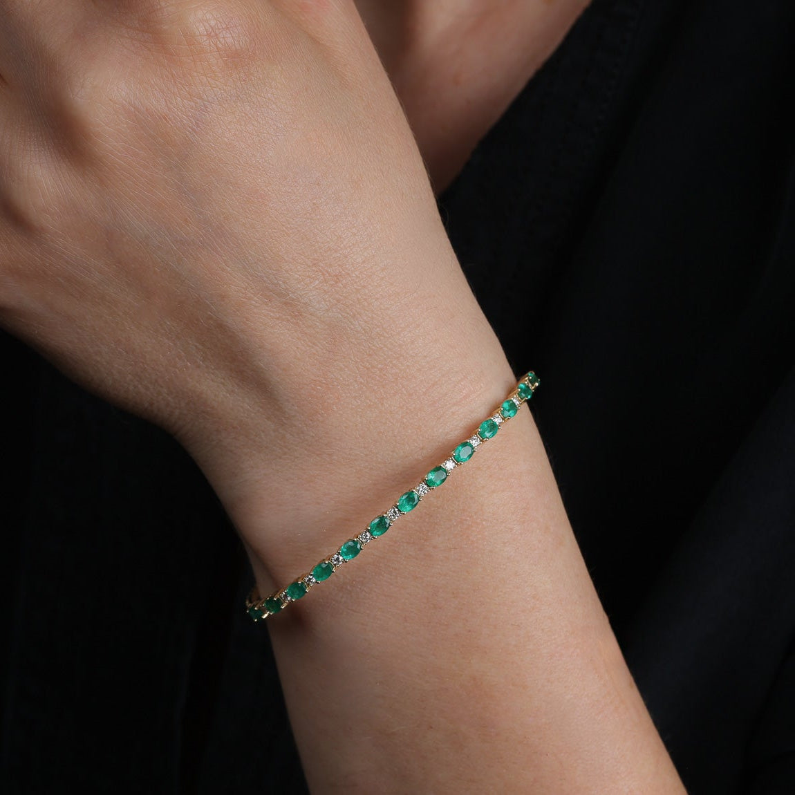 Alternating East to West Set Oval Emerald and Round Diamond Flexible Bangle Bracelet