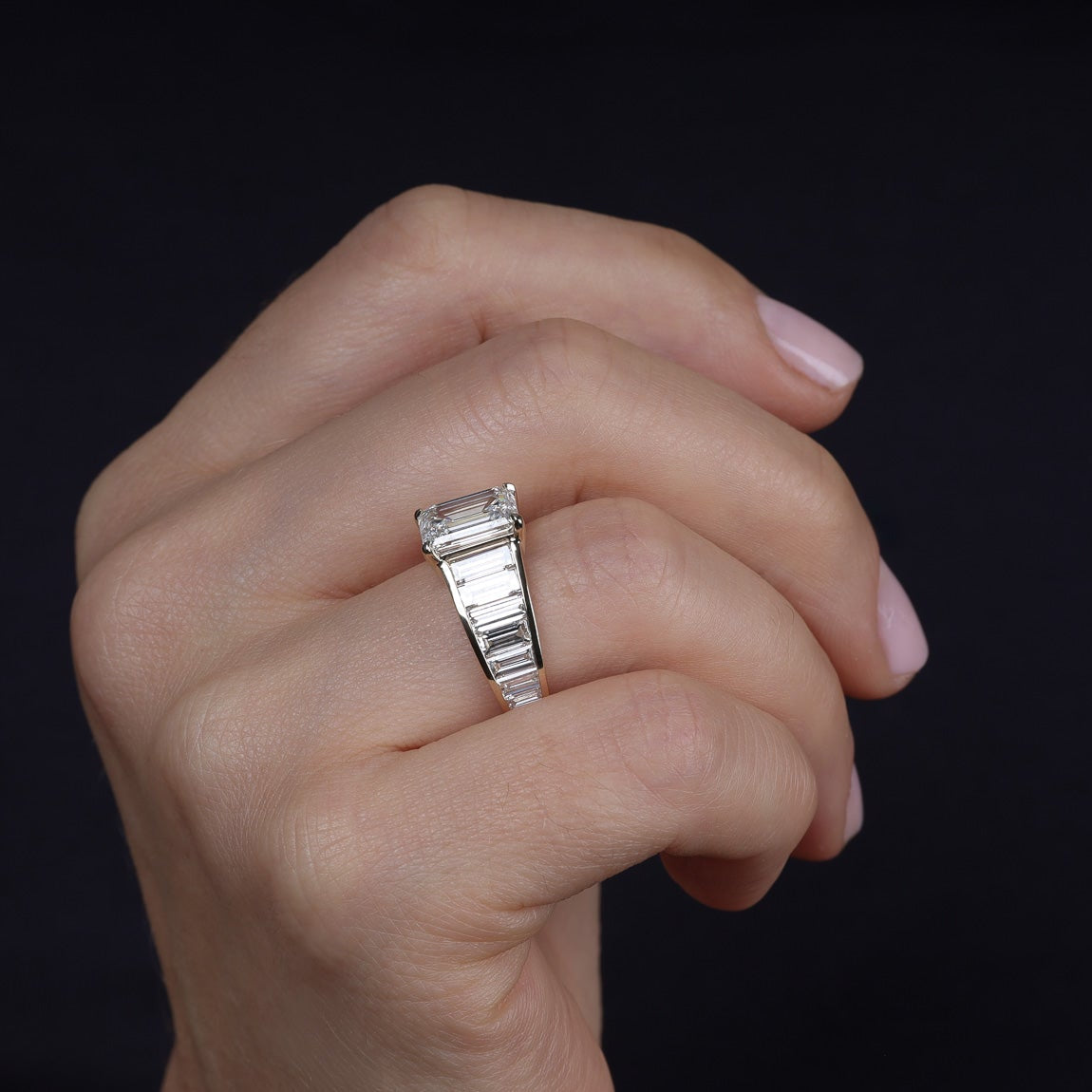 Art Deco graduated baguettes emerald center engagement