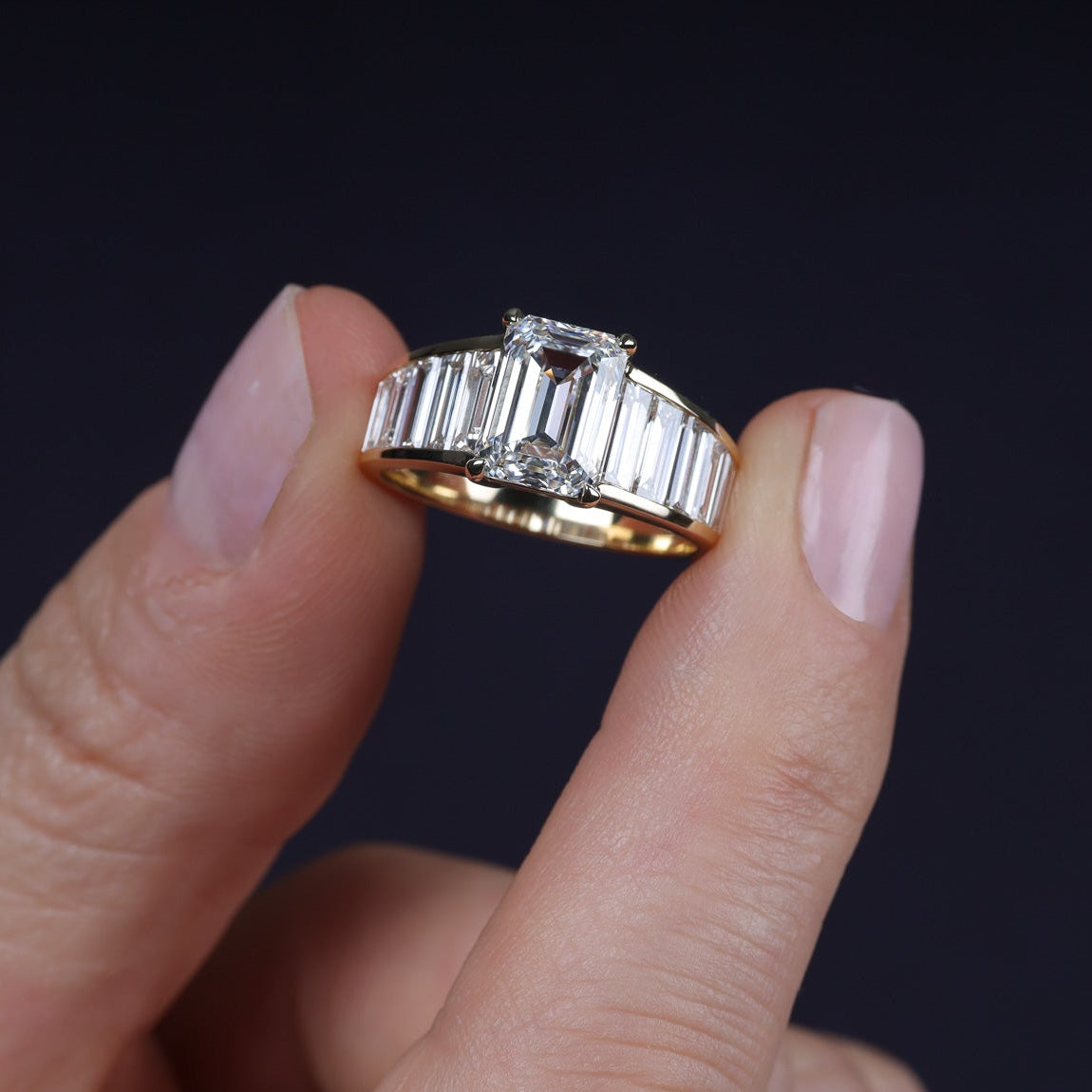 Art Deco graduated baguettes emerald center engagement
