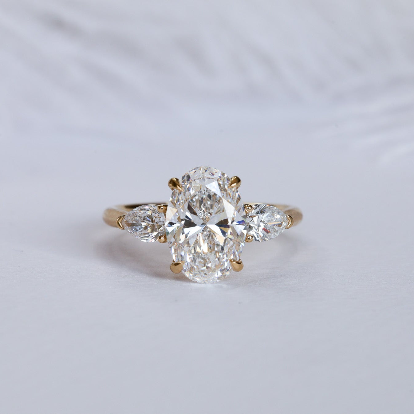 Engagement Ring Three Stones Oval Surrounded by Pears