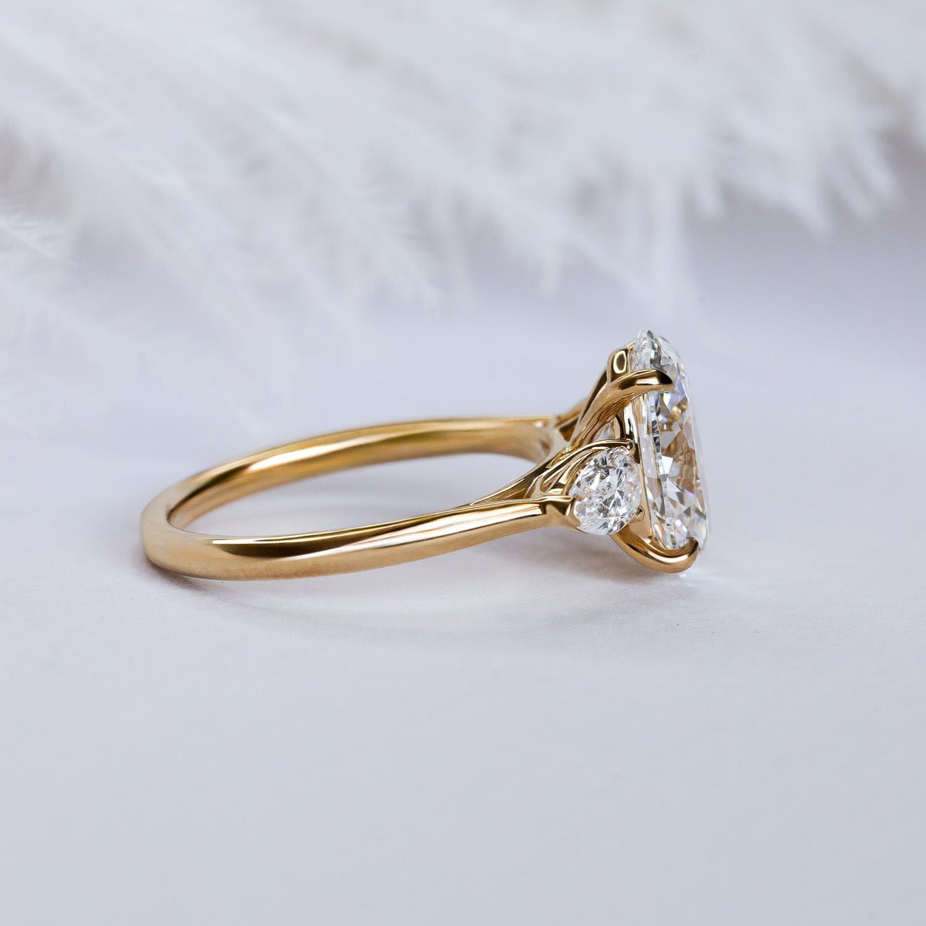 Engagement Ring Three Stones Oval Surrounded by Pears