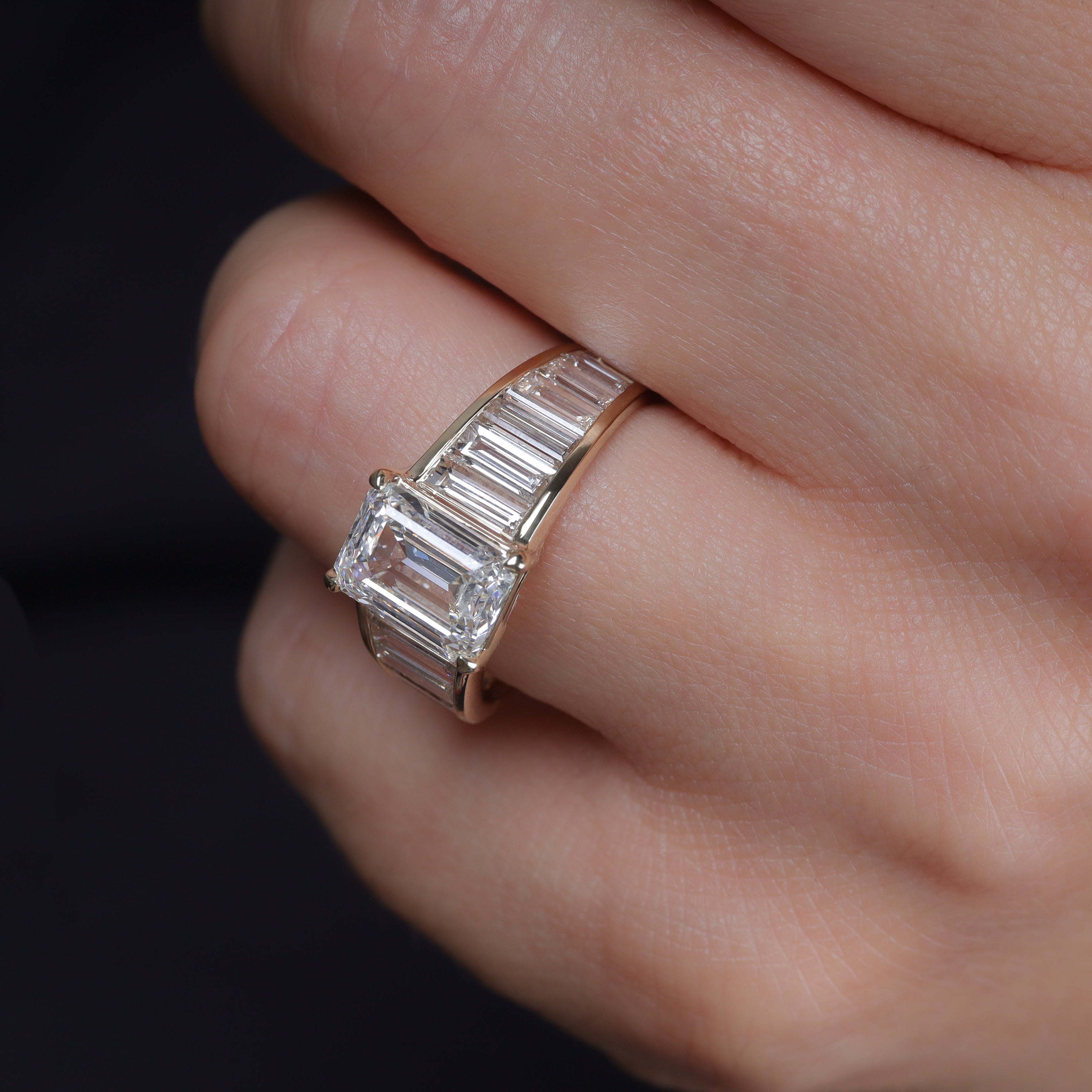 Art Deco graduated  baguettes emerald center engagement 