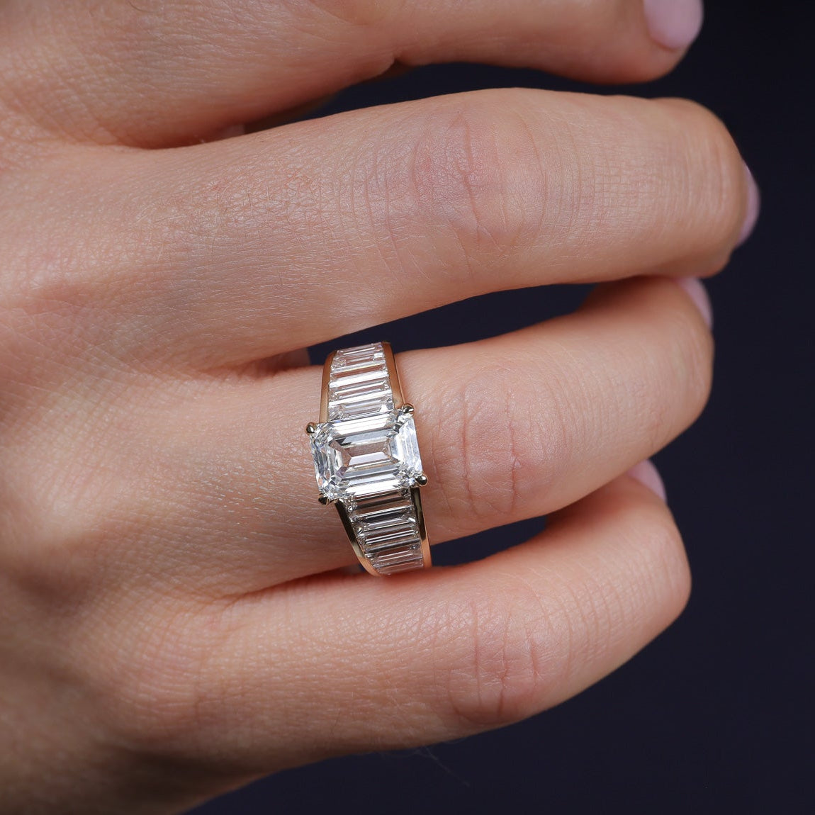 Art Deco graduated  baguettes emerald center engagement 