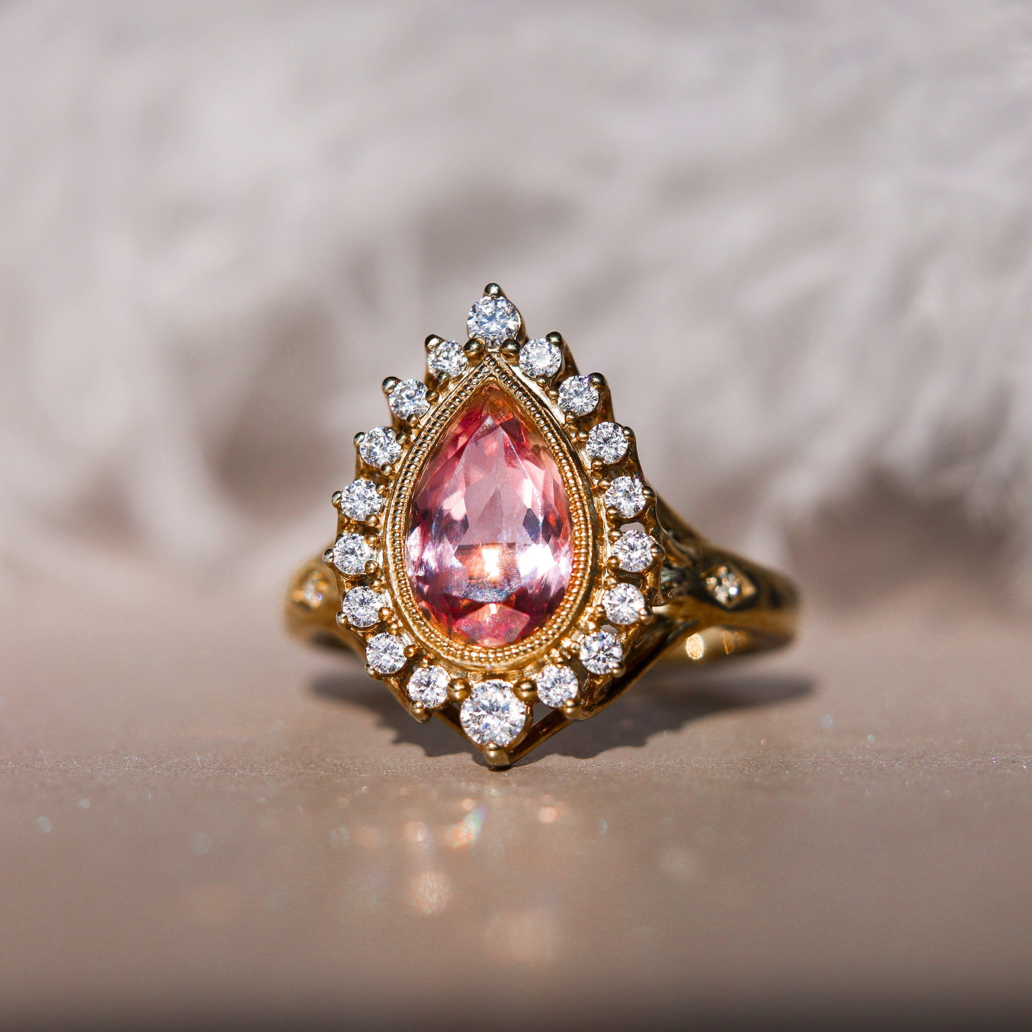 Sunrise Pear Sapphire Ring Millgrain and Halo